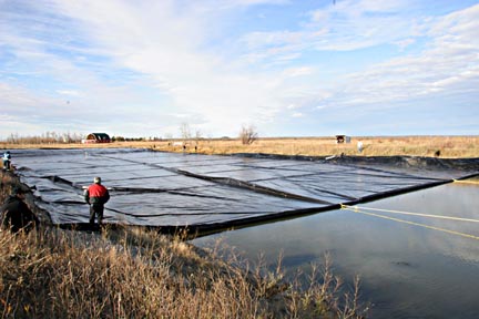 This is a full scale trial of my floating cover design 150 x 250 ft being floated into place.