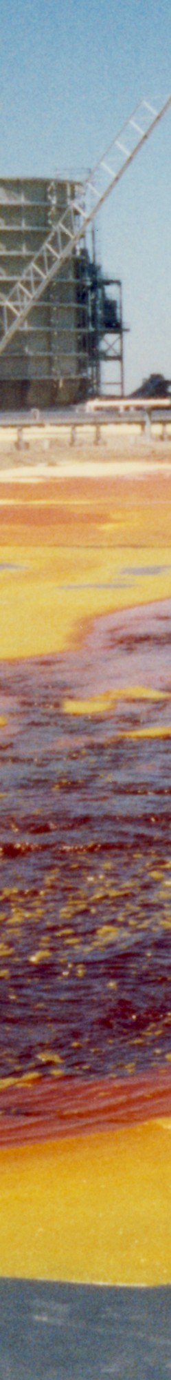 Liquid molten sulphur at 145 degrees Celcius is poured onto a liner for the first time. The research that led to this event was published in the Geo '93 conference.