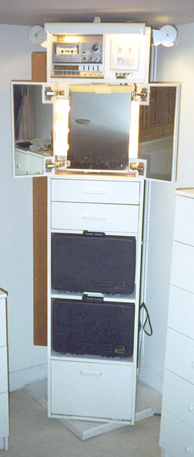 The tower with the top make-up mirror open and all the lights on.